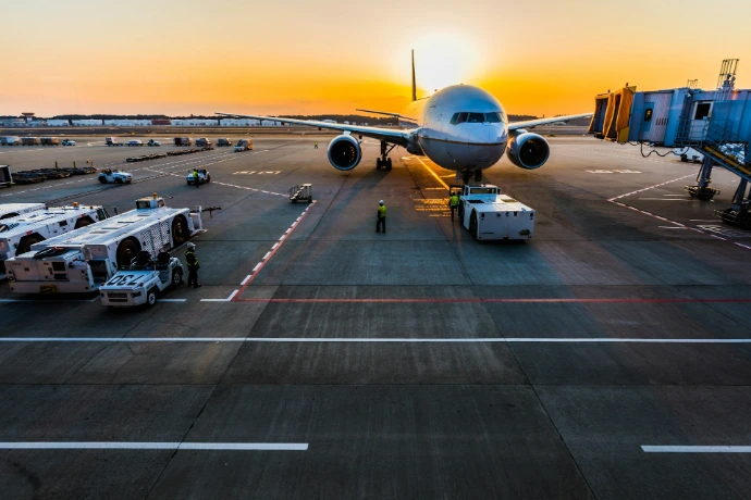 gray airplane on parking